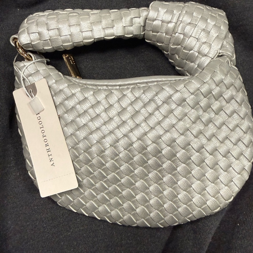 Anthropologie Metallic bag charm. New with tags.
